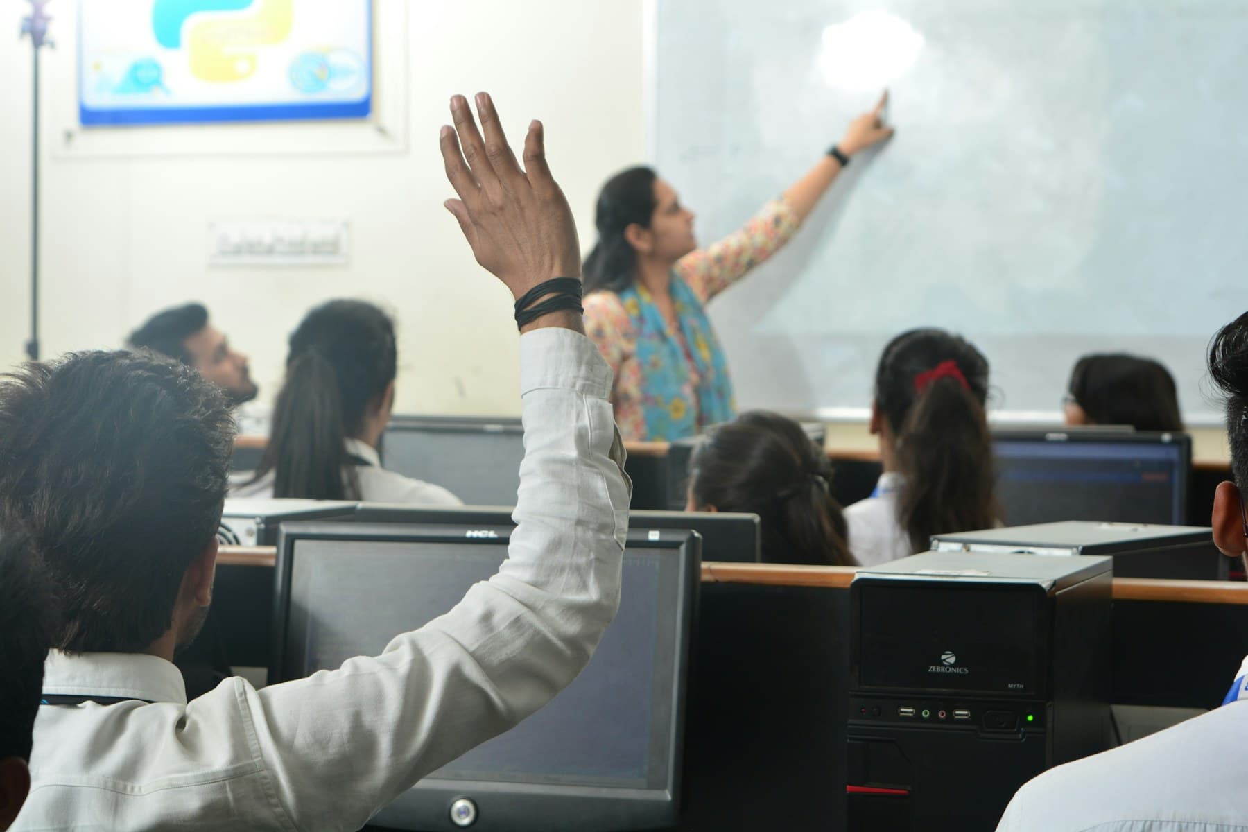 Students working at computers in a classroom